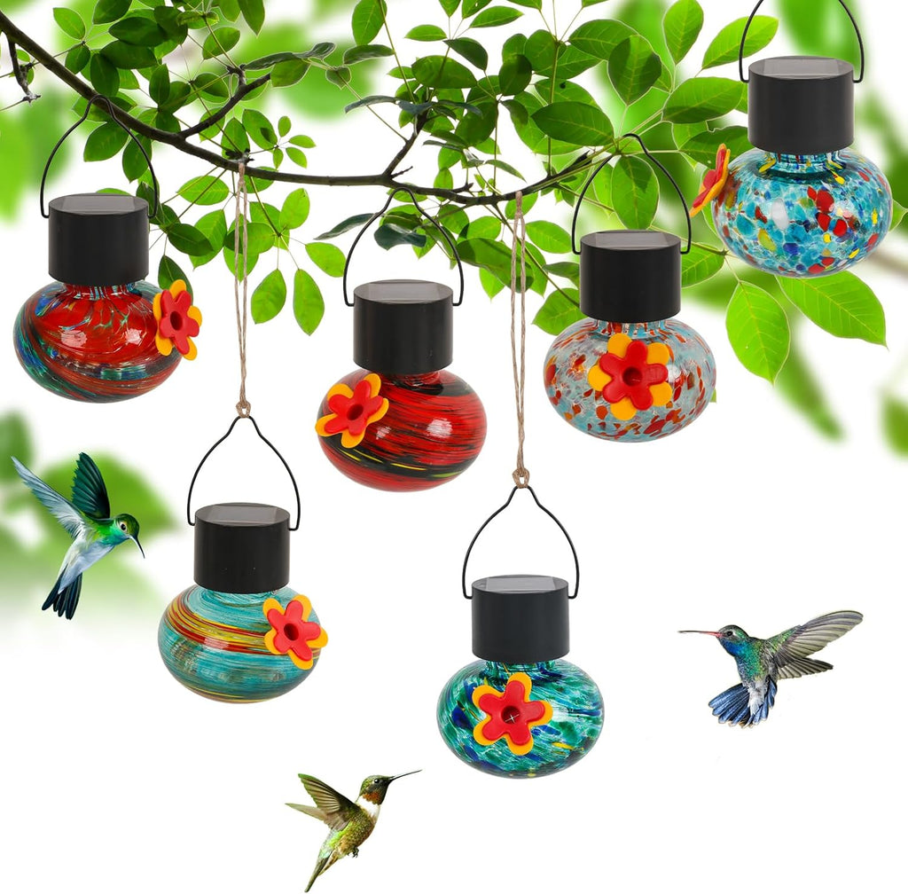 ‌Solar-Powered Hummingbird Feeder with Wind Chime Elegance – 6 Leak-Proof Glass Ports, Frosted Design & Multicolor Night Lights – Perfect Outdoor Gift for Nature Enthusiasts